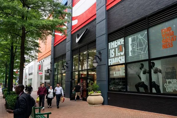 Pedestrians walk past a Nike store in downtown Silver Spring, Maryland, US, on Thursday, May 30, 2024. The Bureau of Economic Analysis is scheduled to release personal consumption figures on May 31. Photographer: Al Drago/Bloomberg