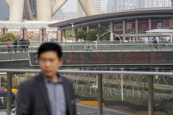 An electronic ticker displays stock figures in Pudong's Lujiazui Financial District in Shanghai, China, on Monday, Feb. 19, 2024. Chinese stocks saw modest gains as onshore traders returned from the Lunar New Year holidays, with broader caution toward the market offsetting buoyant travel and spending data. Photographer: Raul Ariano/Bloomberg