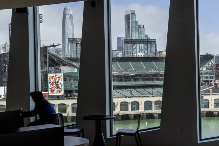 Oracle Park and Salesforce Tower, left, seen from the fifth floor caf at Visa's new headquarters in San Francisco, California, US, on Tuesday, May 28, 2024. Photographer: Philip Pacheco/Bloombergdfd