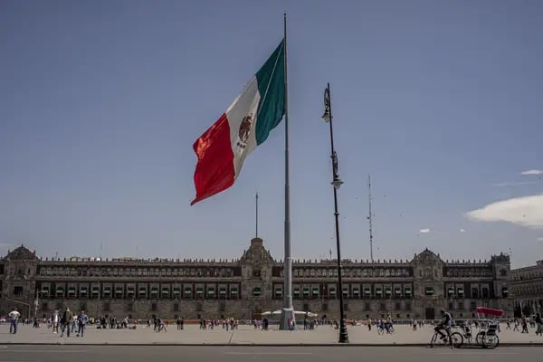 A Mexican flag flies at Constitution Square, known as Zocalo, in Mexico City, Mexico, on Friday Feb. 11, 2022