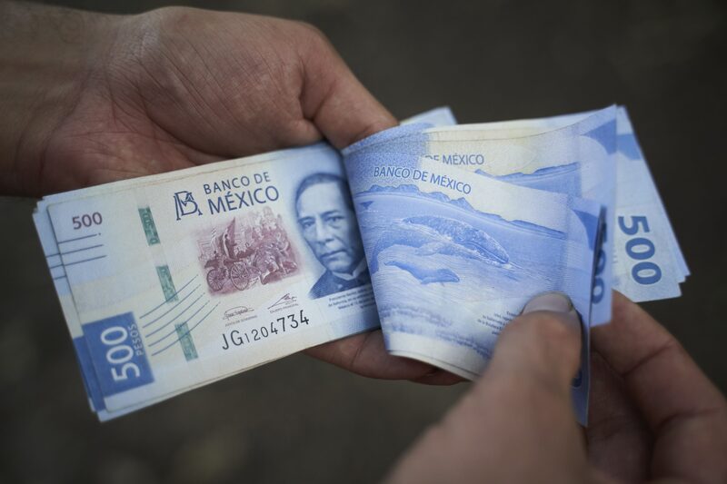 Mexican 500 peso banknotes arranged in Axtla de Terrazas, San Luis Potosi, Mexico, on Sunday, April 2, 2023. The Mexican peso is down 0.2% after inflation came in marginally below estimates, strengthening the view that the monetary tightening cycle may be over. Photographer: Mauricio Palos/Bloomberg