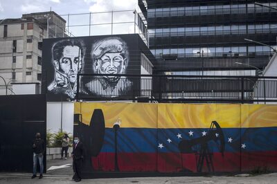 Imagens de Hugo Chavez e Simon Bolivar em Caracas