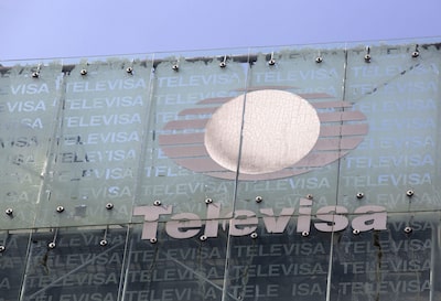 Grupo Televisa SAB signage is displayed on top of the company's building in Mexico City, Mexico, on Thursday, July 11, 2013. Grupo Televisa SABB, the largest Spanish-language TV producer, rose the most in more than a year as cable and satellite subscriptions helped increase second-quarter profit by 31 percent. Photographer: Susana Gonzalez/Bloomberg