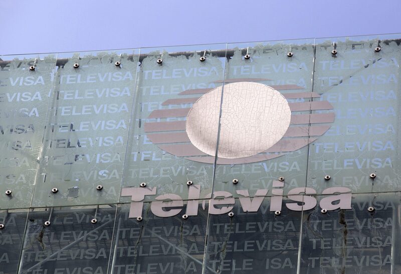 Grupo Televisa SAB signage is displayed on top of the company's building in Mexico City, Mexico, on Thursday, July 11, 2013. Grupo Televisa SABB, the largest Spanish-language TV producer, rose the most in more than a year as cable and satellite subscriptions helped increase second-quarter profit by 31 percent. Photographer: Susana Gonzalez/Bloomberg