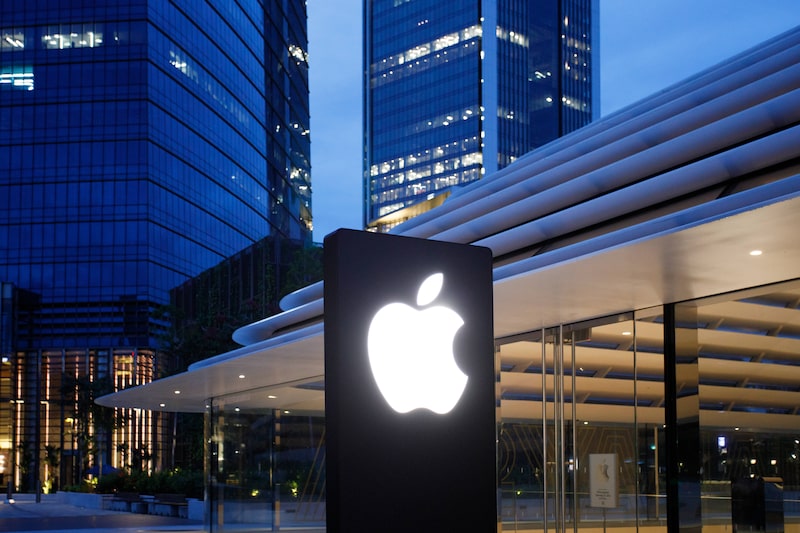 Signage outside the Apple Inc. store ahead of its opening at dawn in Kuala Lumpur, Malaysia, on Saturday, June 22, 2024. Malaysia is becoming an increasingly key country for Apple on both production and sales fronts. The US company started production of some Macs in Malaysia a couple of years ago, while it is also producing some iPhones in India and AirPods in Vietnam. Photographer: Samsul Said/Bloomberg