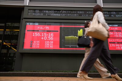 The rate of the US dollar against the yen displayed on an electronic stock board outside a securities firm in Tokyo, Japan, on Friday, April 26, 2024. The Bank of Japan held its interest rate settings steady and simplified its language on bond-buying at a two-day meeting that took place after the yen hit a fresh 34-year low this week. Photographer: Akio Kon/Bloomberg