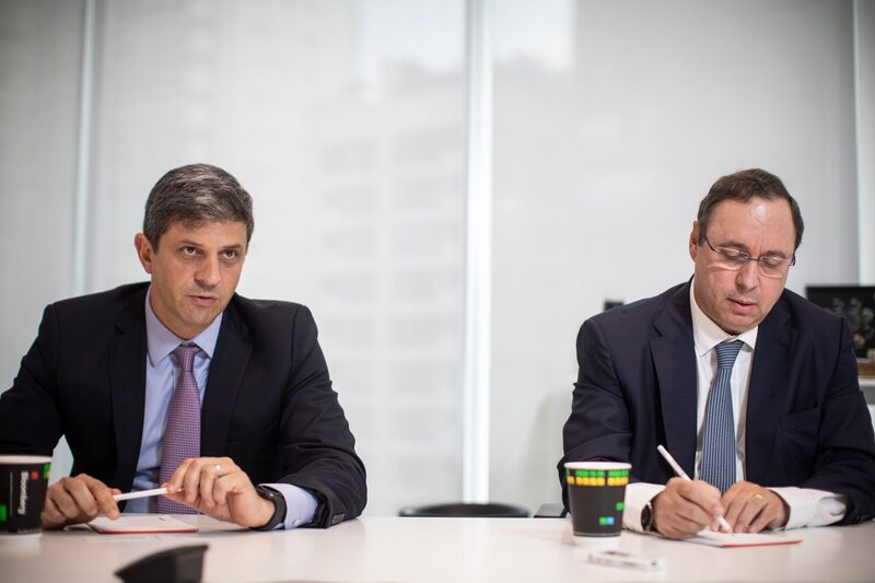 Adriano Sartori, vice president of CBRE Consultoria Do Brasil, speaks while Walter Cardoso, president of CBRE Consultoria Do Brasil, right, listens during an interview in Sao Paulo, Brazil, on Tuesday, April 23, 2019. CBRE commenced operations in Brazil in 1979, after having identified Brazil as a promising market with a growing demand for real estate consultancy and a high degree of complexity in property transactions. Photographer: Victor Moriyama/Bloomberg